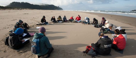 Teachers-circle-up-on-the-beach-at-the-2013-Pedagogy-of-Place.-Credit-Duncan-Barry